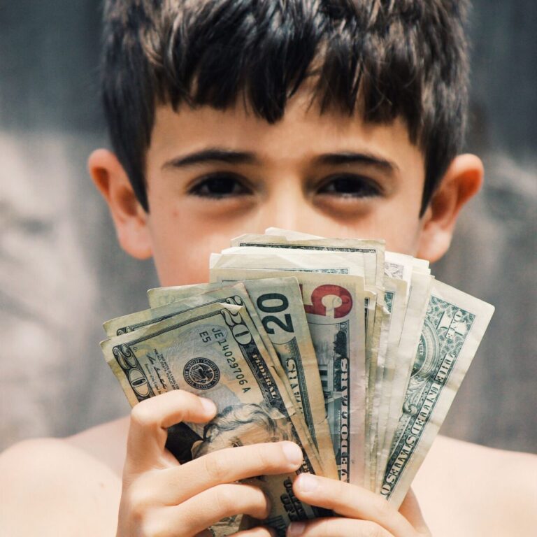 boy-holding-money-2024-09-12-08-12-42-utc