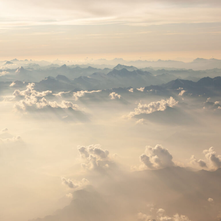 Fluffy white clouds, a view from airplane window. Top view