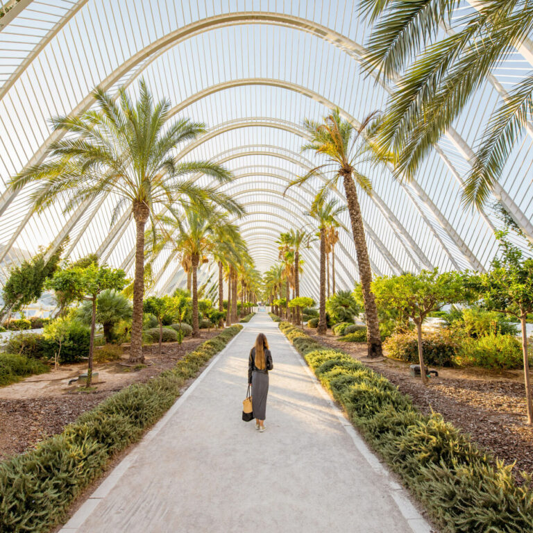 View on the modern park with woman walking in Valencia city, Spain